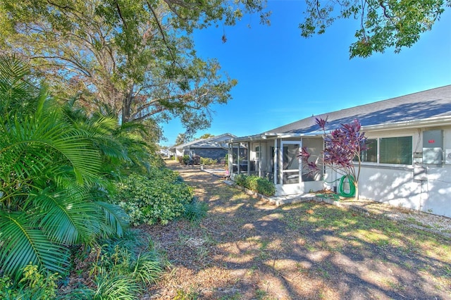 view of yard featuring a sunroom