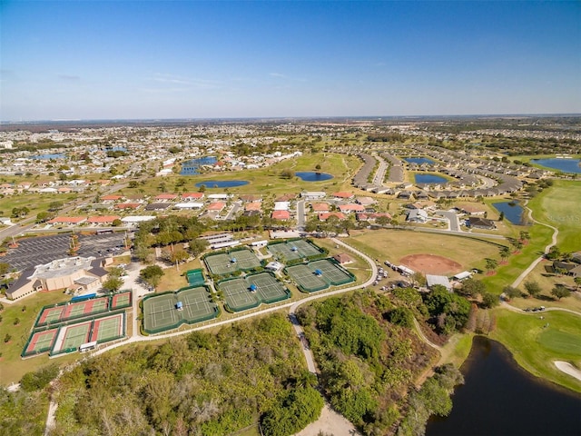 aerial view featuring golf course view and a water view