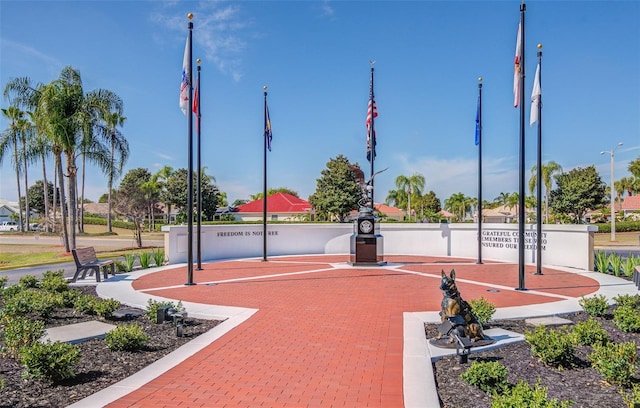 view of home's community featuring fence