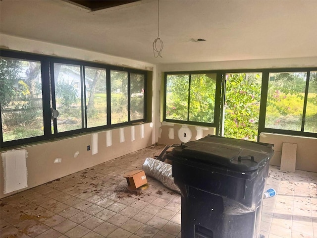 sunroom with radiator heating unit