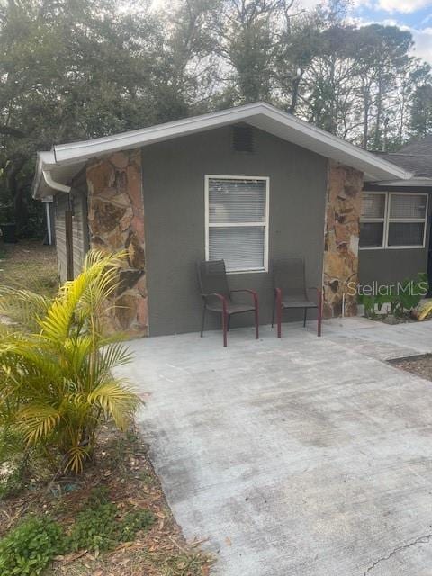 view of home's exterior with a patio area and stucco siding