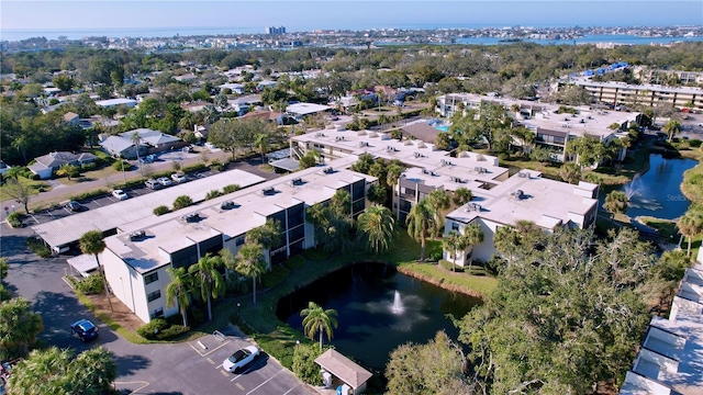 drone / aerial view featuring a residential view and a water view