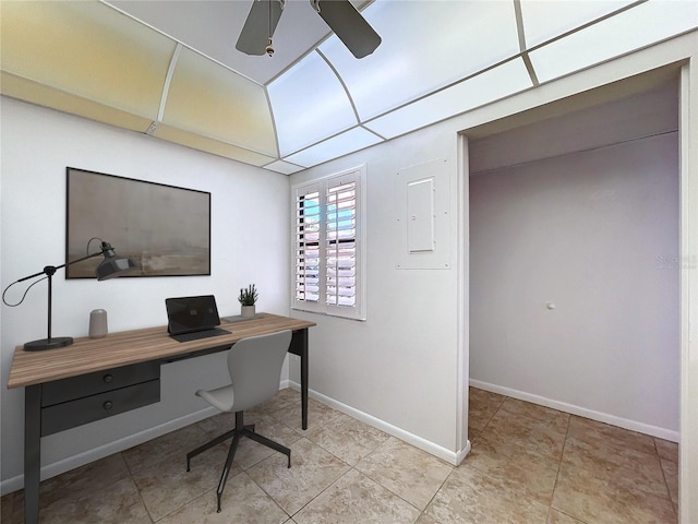 office area with a ceiling fan, baseboards, and light tile patterned floors