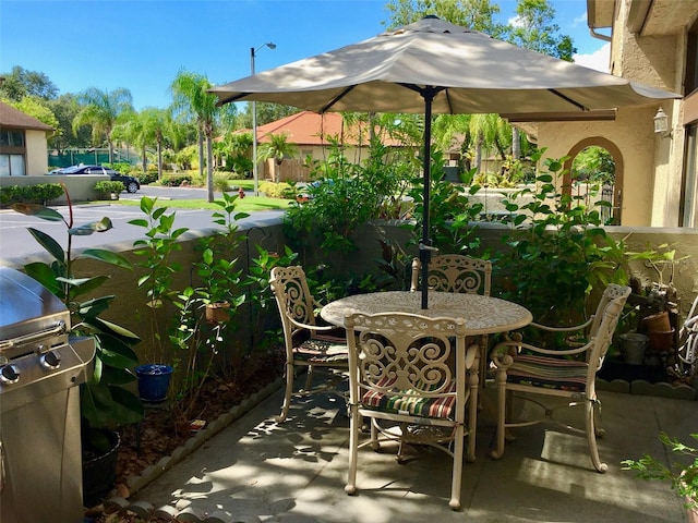 view of patio featuring outdoor dining space