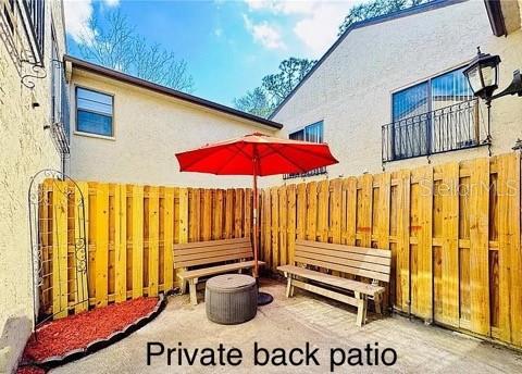 view of patio featuring fence