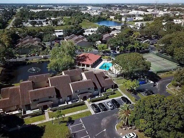 birds eye view of property with a water view and a residential view