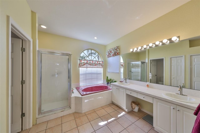 full bathroom with vanity, tile patterned floors, independent shower and bath, and toilet