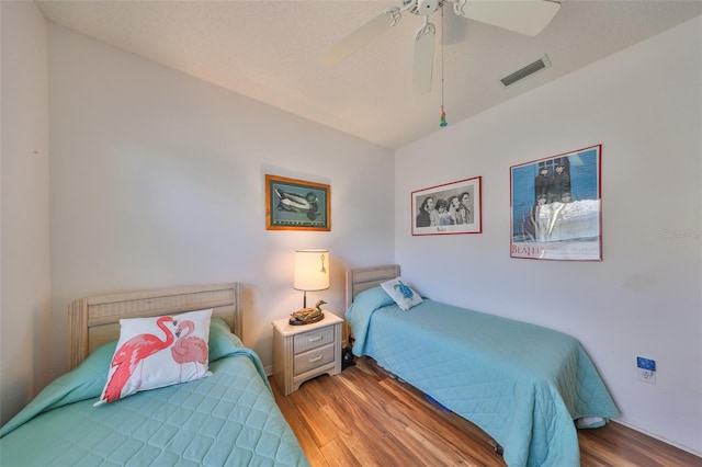 bedroom with hardwood / wood-style flooring and ceiling fan