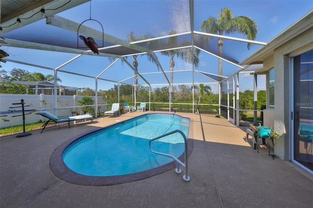 view of pool featuring a lanai and a patio area