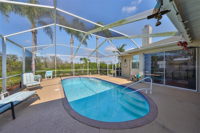 view of pool with a lanai and a patio area