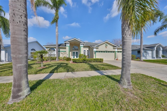 ranch-style house with a garage and a front lawn