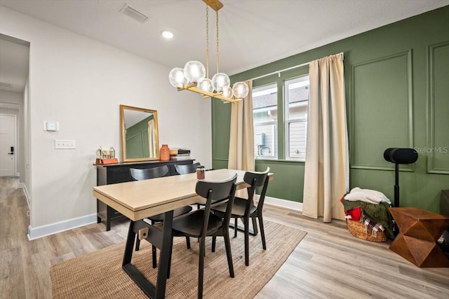 dining space featuring light wood-type flooring