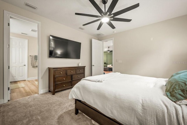 bedroom featuring light carpet and ceiling fan