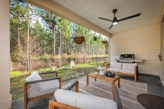 view of patio with ceiling fan, an outdoor living space, and a grill