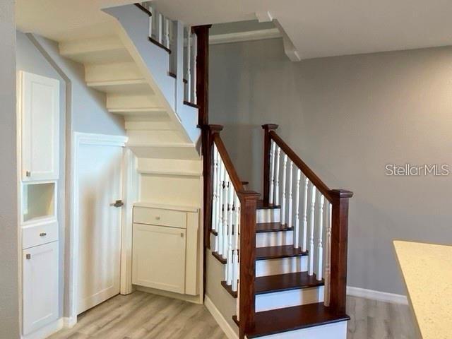 1829 10th St N, Saint Petersburg, FL 33704 - staircase featuring hardwood / wood-style floors