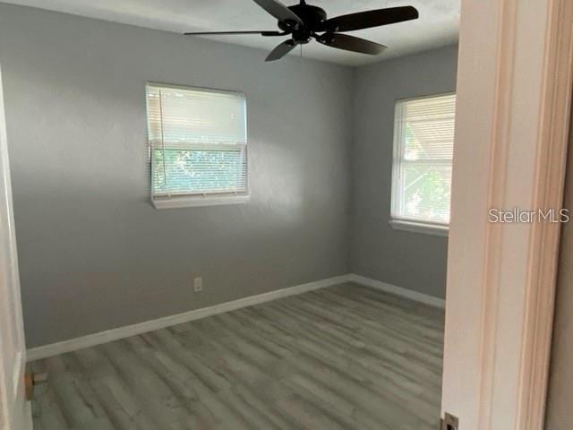 1829 10th St N, Saint Petersburg, FL 33704 - spare room featuring hardwood / wood-style floors and ceiling fan