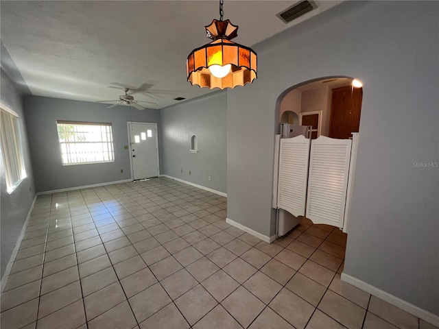 1829 10th St N, Saint Petersburg, FL 33704 - empty room with light tile patterned floors and ceiling fan