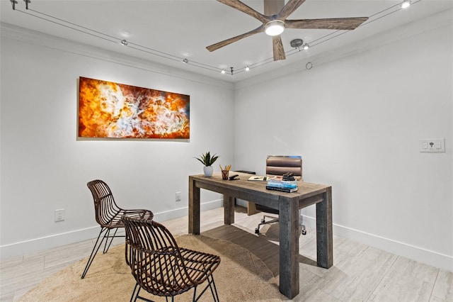 office with ornamental molding, track lighting, light hardwood / wood-style floors, and ceiling fan