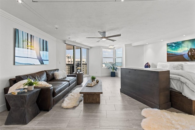 interior space featuring access to exterior, a textured ceiling, and ceiling fan