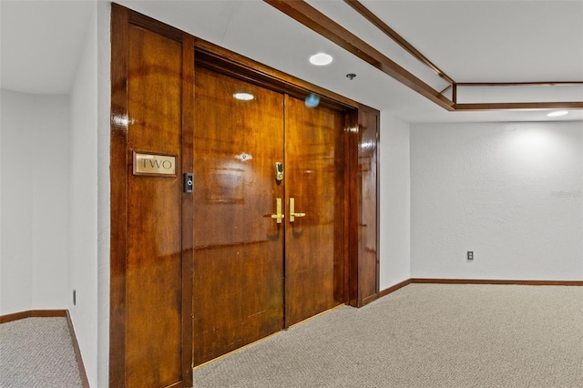 hallway with carpet