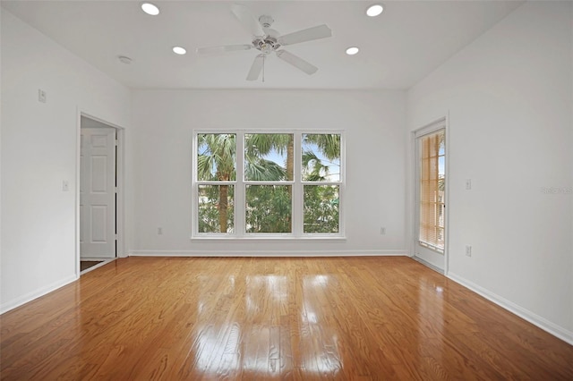 unfurnished room with ceiling fan and light hardwood / wood-style floors