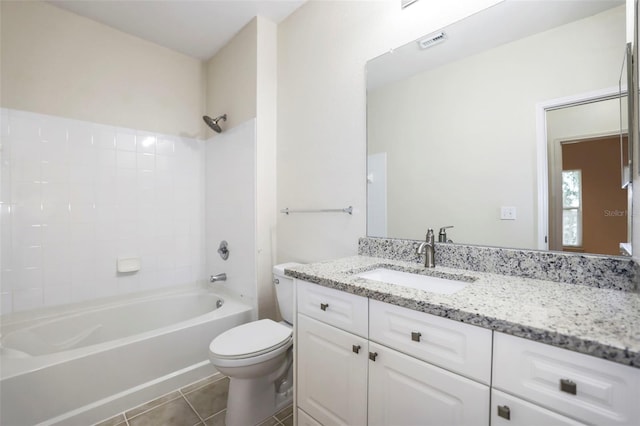 full bathroom featuring vanity, toilet, tub / shower combination, and tile patterned flooring