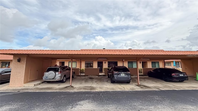 view of front facade with a carport