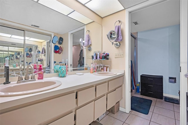 bathroom featuring tile patterned floors and vanity