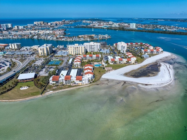 birds eye view of property featuring a water view and a beach view