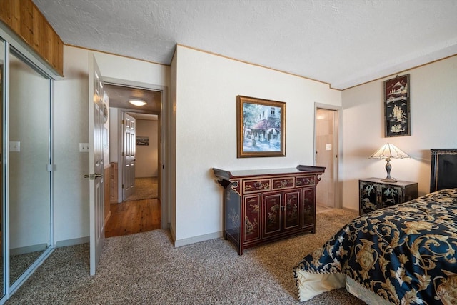 carpeted bedroom with a textured ceiling