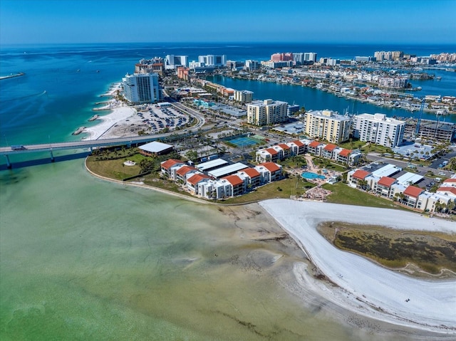 birds eye view of property featuring a water view and a view of the beach