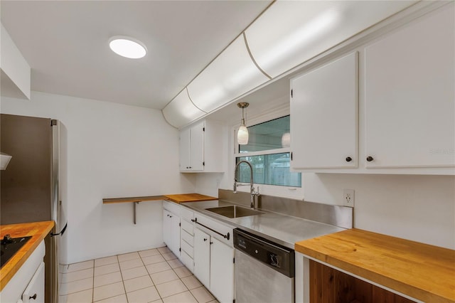 kitchen featuring stainless steel appliances, white cabinetry, and a sink