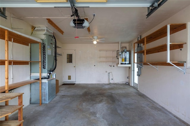 garage with a garage door opener, water heater, and heating unit