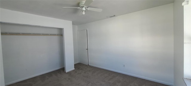 unfurnished bedroom featuring carpet floors, a closet, and ceiling fan