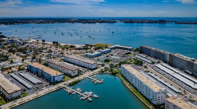 birds eye view of property featuring a water view and a view of city