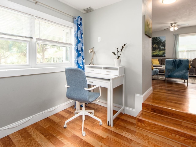 office with ceiling fan and wood-type flooring