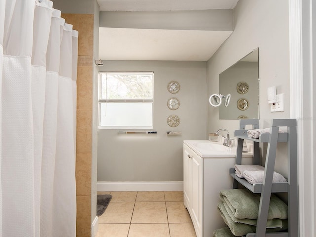 bathroom featuring vanity, tile patterned flooring, and curtained shower