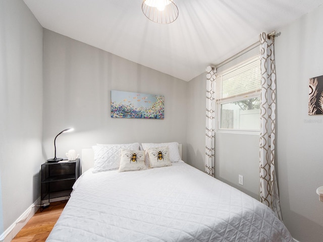 bedroom with hardwood / wood-style floors