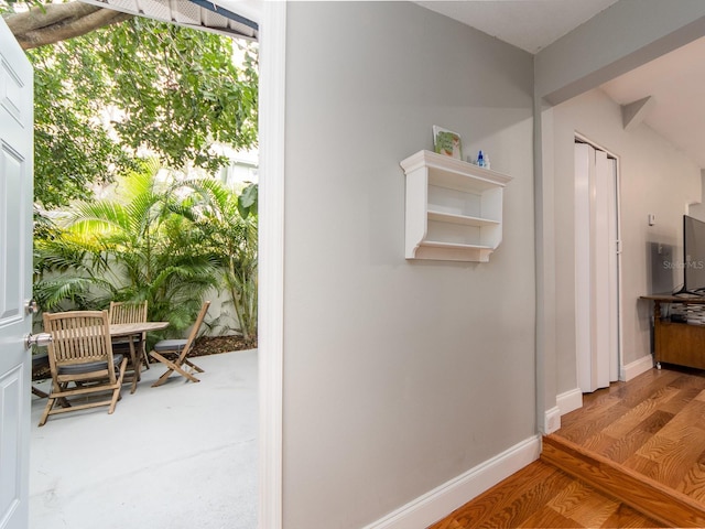 hallway featuring hardwood / wood-style floors