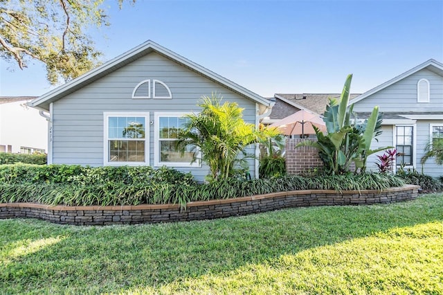 view of home's exterior with a lawn