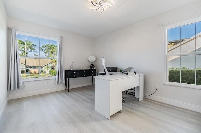 office area with light wood-type flooring