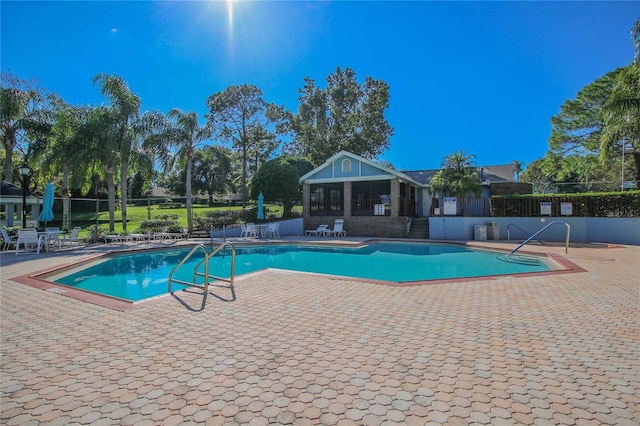 view of swimming pool with a patio