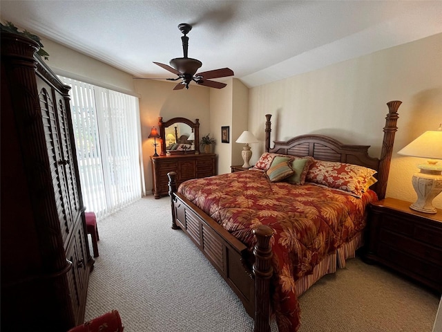 bedroom featuring light carpet, access to outside, lofted ceiling, and ceiling fan