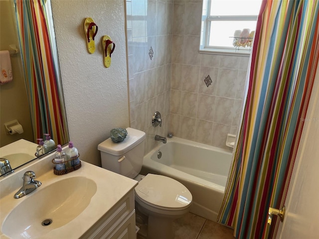 full bathroom featuring shower / bath combination with curtain, vanity, toilet, and tile patterned flooring