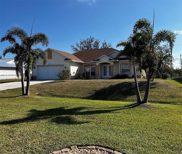 ranch-style house featuring a garage and a front yard