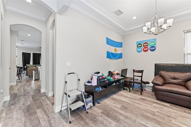 living room with arched walkways, crown molding, recessed lighting, visible vents, and wood finished floors