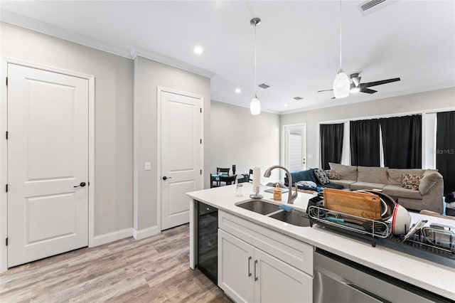 kitchen with a sink, visible vents, dishwasher, decorative light fixtures, and crown molding