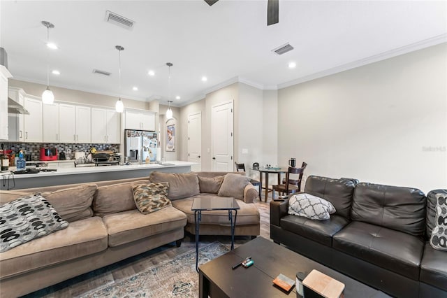 living room featuring recessed lighting, visible vents, and wood finished floors