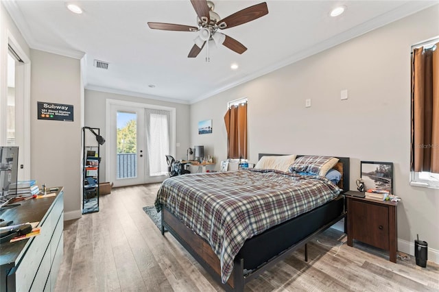 bedroom with visible vents, baseboards, access to outside, light wood-type flooring, and crown molding