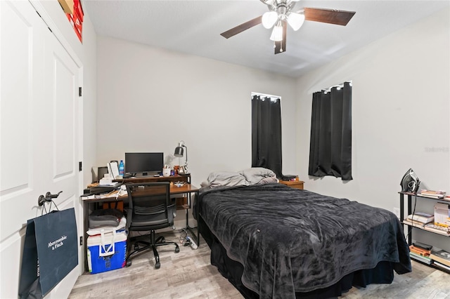 bedroom featuring wood finished floors and a ceiling fan